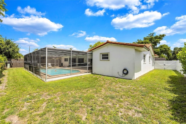 6736 Orchid Dr, Miami Lakes, FL 33014 - rear view of property featuring a gate, a fenced backyard, stucco siding, and a lanai