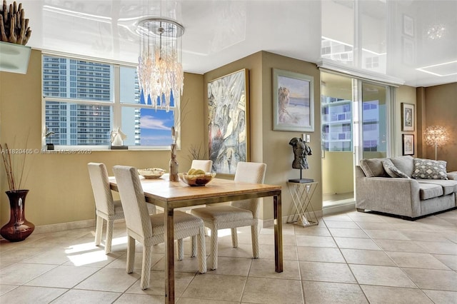 1833 S Ocean Dr Unit 1402, Hallandale Beach, FL 33009 - tiled dining room with a chandelier and baseboards