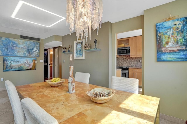 1833 S Ocean Dr Unit 1402, Hallandale Beach, FL 33009 - dining room featuring light tile patterned floors and baseboards