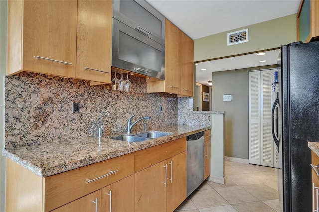 1833 S Ocean Dr Unit 1402, Hallandale Beach, FL 33009 - kitchen with appliances with stainless steel finishes, light tile patterned floors, light stone counters, and decorative backsplash