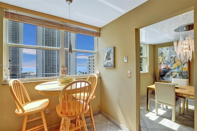 1833 S Ocean Dr Unit 1402, Hallandale Beach, FL 33009 - dining area featuring tile patterned flooring and a chandelier