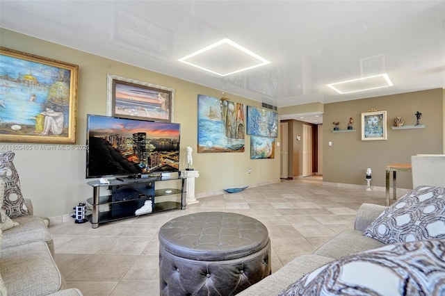 1833 S Ocean Dr Unit 1402, Hallandale Beach, FL 33009 - living room featuring light tile patterned floors and baseboards