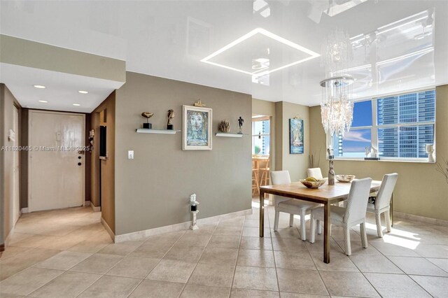 1833 S Ocean Dr Unit 1402, Hallandale Beach, FL 33009 - dining area featuring a chandelier and light tile patterned floors