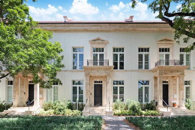 647 Almeria Ave, Coral Gables, FL 33134 - greek revival inspired property featuring stucco siding and a balcony