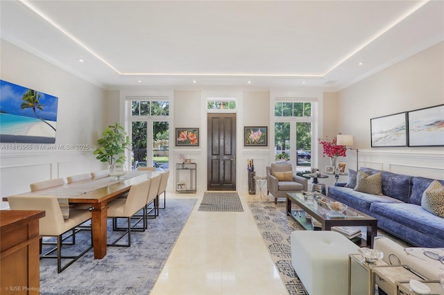 647 Almeria Ave, Coral Gables, FL 33134 - living room with a decorative wall, a raised ceiling, french doors, wainscoting, and recessed lighting
