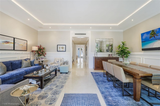 647 Almeria Ave, Coral Gables, FL 33134 - living area featuring a tray ceiling, a decorative wall, recessed lighting, and wainscoting