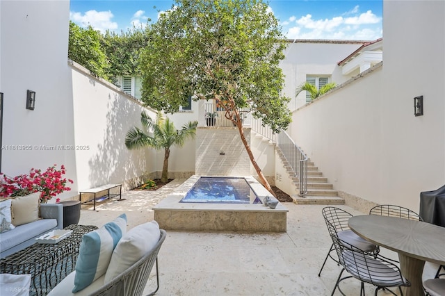 647 Almeria Ave, Coral Gables, FL 33134 - fenced backyard featuring stairway, a patio, and an outdoor living space with a fire pit