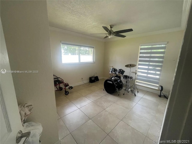 411 Martin Rd, Margate, FL 33068 - interior space featuring ornamental molding, a ceiling fan, light tile patterned flooring, and a textured ceiling