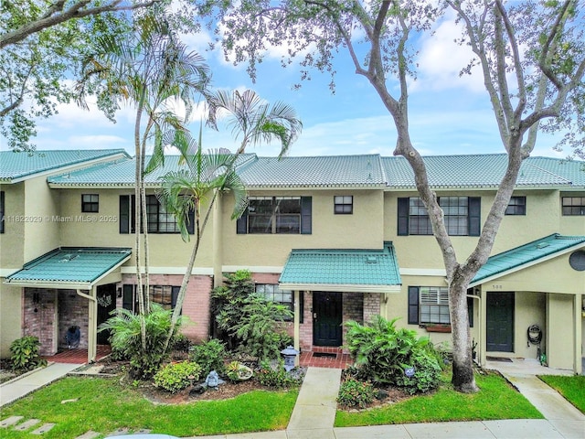 502 Westree Ln, Plantation, FL 33324 - view of property featuring stucco siding and brick siding