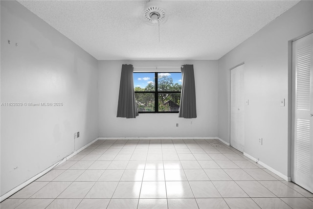 502 Westree Ln, Plantation, FL 33324 - spare room featuring a textured ceiling and baseboards