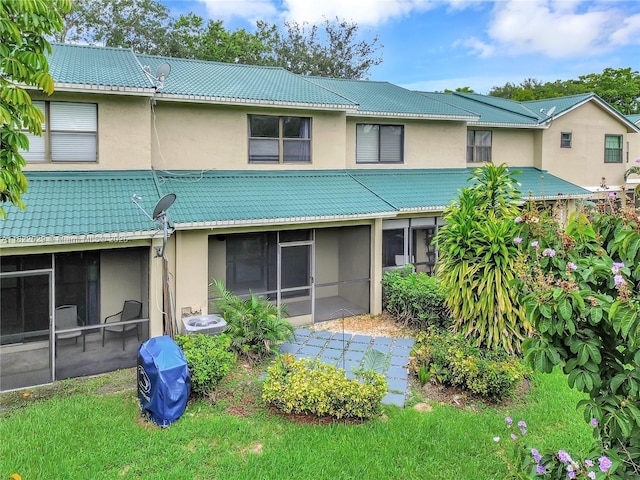 502 Westree Ln, Plantation, FL 33324 - rear view of house featuring a sunroom, stucco siding, and a tile roof