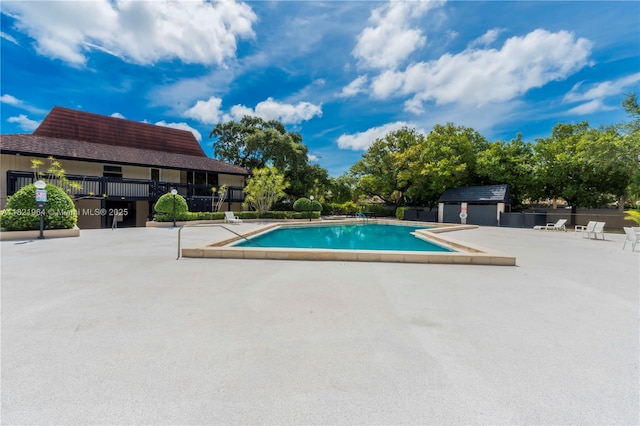511 Ives Dairy Rd Unit 104-6, Miami, FL 33179 - community pool featuring a patio area and an outdoor structure