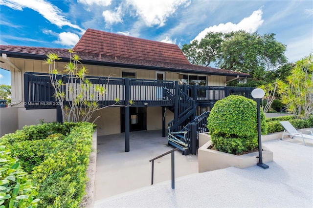 511 Ives Dairy Rd Unit 104-6, Miami, FL 33179 - exterior space with stairway and a deck