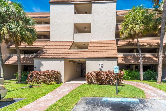 511 Ives Dairy Rd Unit 104-6, Miami, FL 33179 - view of apartment building / complex with uncovered parking