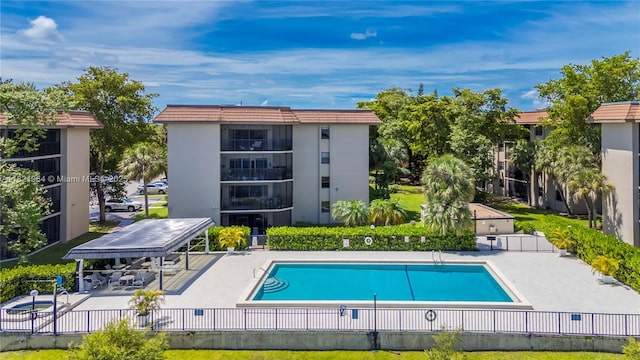 511 Ives Dairy Rd Unit 104-6, Miami, FL 33179 - community pool featuring a patio area