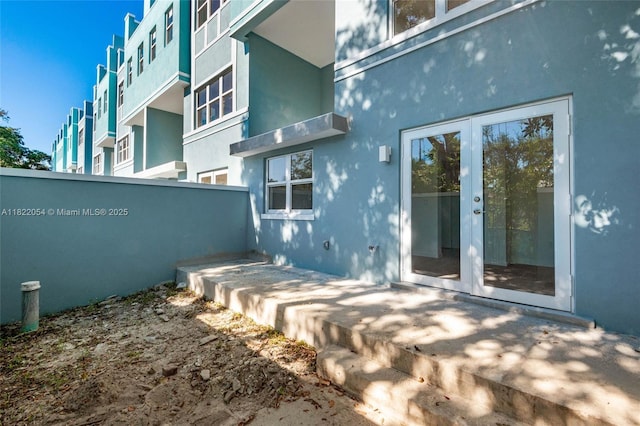 824 SE 12th Ct, Fort Lauderdale, FL 33316 - exterior space featuring french doors and stucco siding