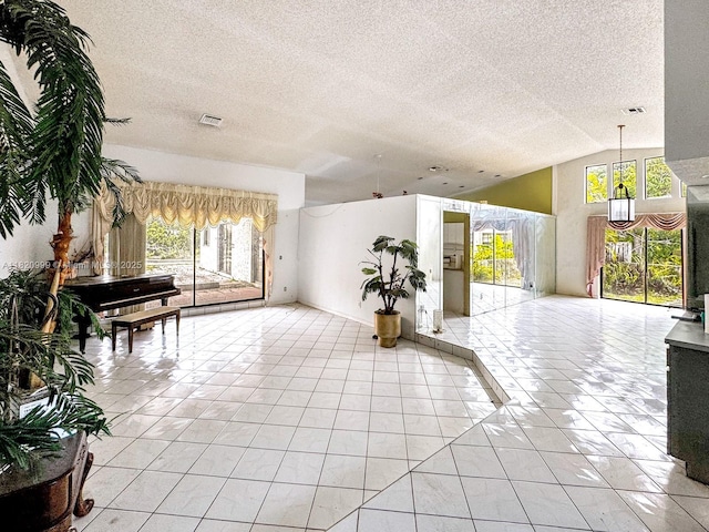 4550 NW 65th Way, Lauderhill, FL 33319 - community lobby with vaulted ceiling and a textured ceiling
