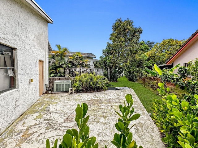 4550 NW 65th Way, Lauderhill, FL 33319 - fenced backyard with a patio area