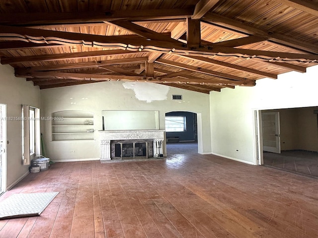 531 NE 55th Ter, Miami, FL 33137 - unfurnished living room featuring arched walkways, hardwood / wood-style flooring, a fireplace, and wooden ceiling