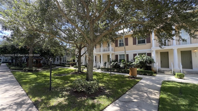 4163 Maya Cay Ln, Jupiter, FL 33458 - view of front of home featuring a front lawn and a balcony