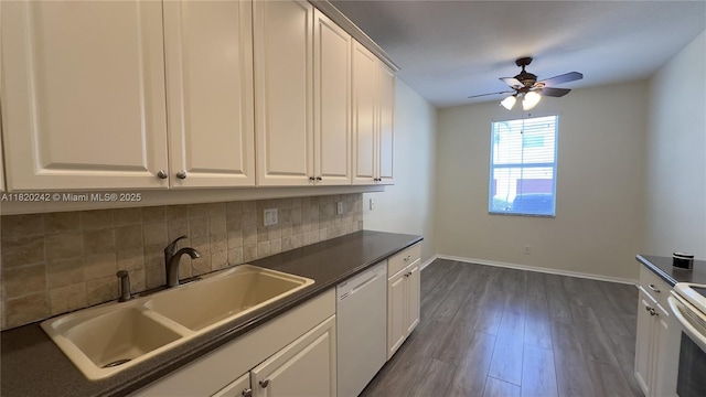 4163 Maya Cay Ln, Jupiter, FL 33458 - kitchen with white dishwasher, decorative backsplash, dark countertops, and a ceiling fan