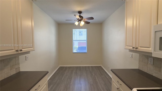 4163 Maya Cay Ln, Jupiter, FL 33458 - unfurnished dining area with ceiling fan and dark wood finished floors