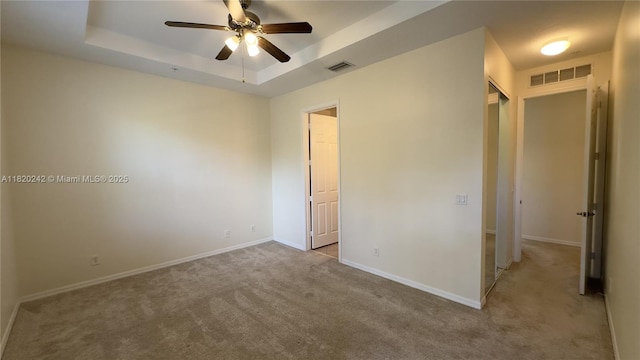 4163 Maya Cay Ln, Jupiter, FL 33458 - unfurnished bedroom with carpet floors and a raised ceiling