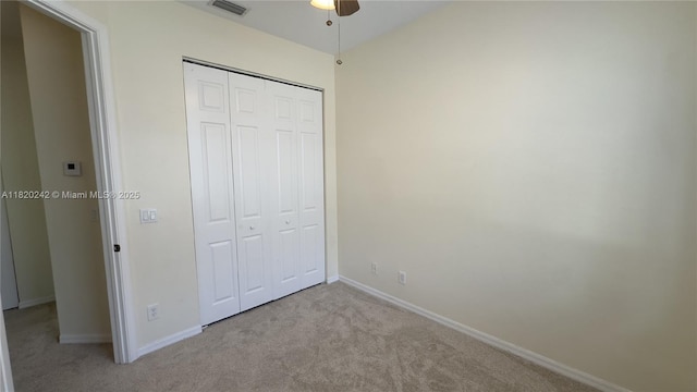4163 Maya Cay Ln, Jupiter, FL 33458 - unfurnished bedroom with carpet floors, a closet, and a ceiling fan