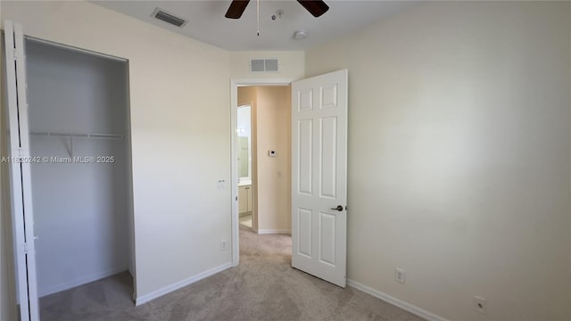 4163 Maya Cay Ln, Jupiter, FL 33458 - unfurnished bedroom featuring carpet flooring, a closet, and ceiling fan