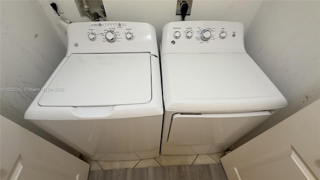 4163 Maya Cay Ln, Jupiter, FL 33458 - laundry area featuring independent washer and dryer and wood finished floors