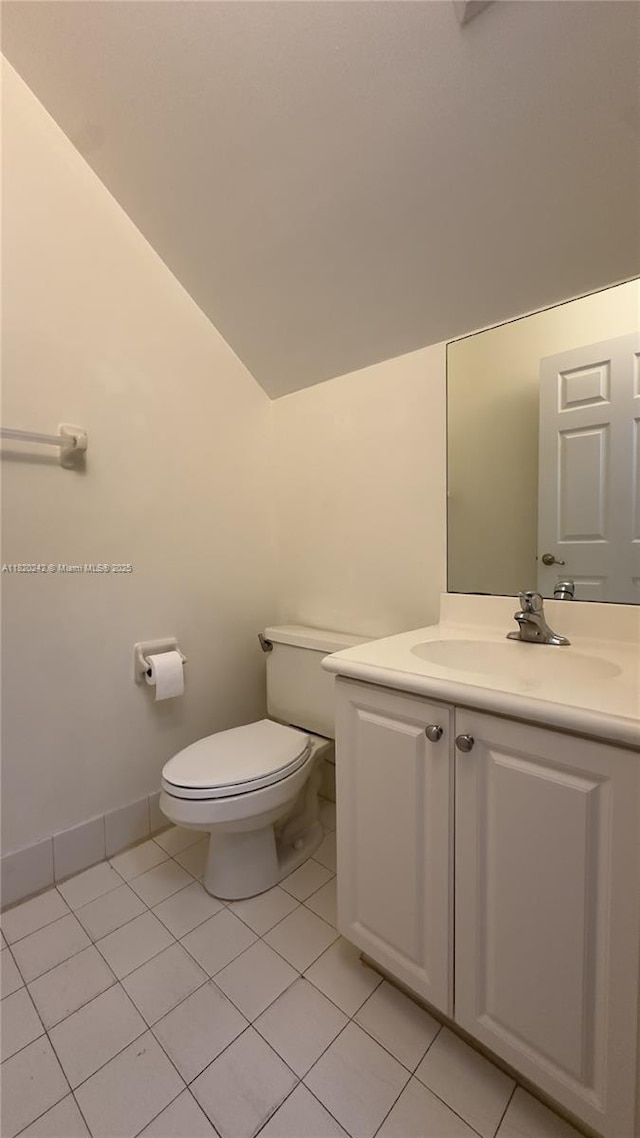 4163 Maya Cay Ln, Jupiter, FL 33458 - half bath featuring vanity, vaulted ceiling, and tile patterned floors