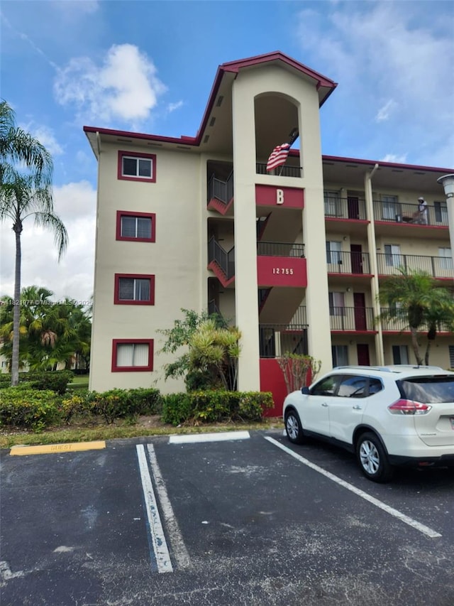 12755 SW 16th Ct Unit 201B, Pembroke Pines, FL 33027 - view of apartment building / complex with uncovered parking