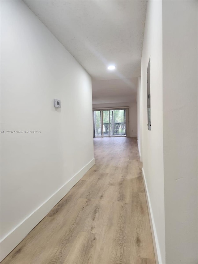 12755 SW 16th Ct Unit 201B, Pembroke Pines, FL 33027 - hallway with light wood-style floors and electric panel