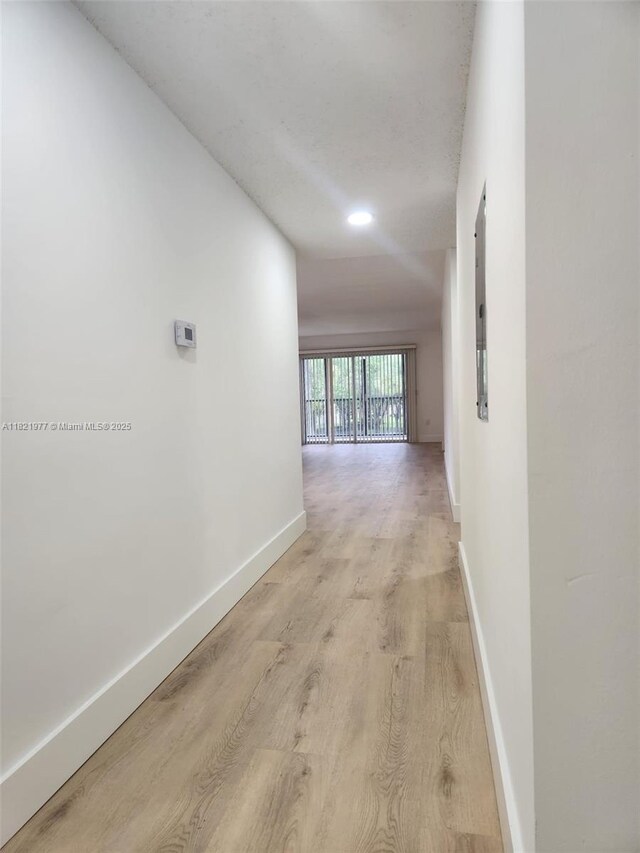 12755 SW 16th Ct Unit 201B, Pembroke Pines, FL 33027 - corridor with light wood finished floors and electric panel