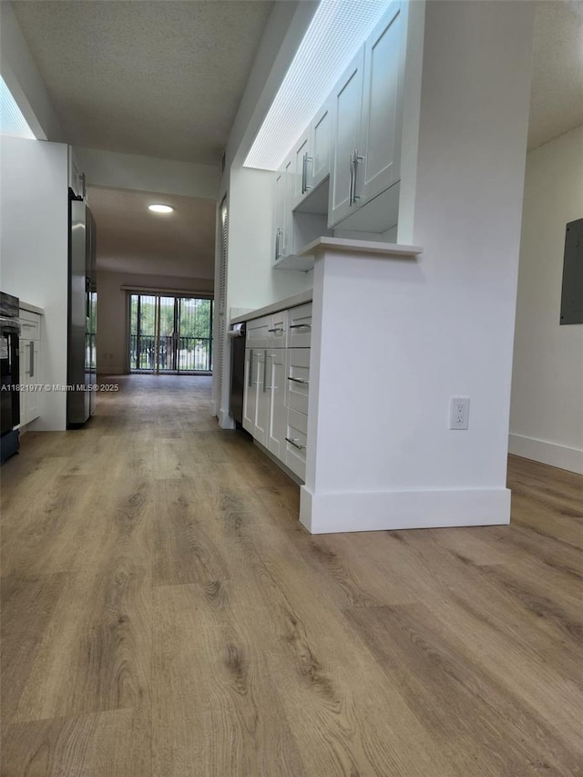 12755 SW 16th Ct Unit 201B, Pembroke Pines, FL 33027 - unfurnished living room with wood finished floors and recessed lighting