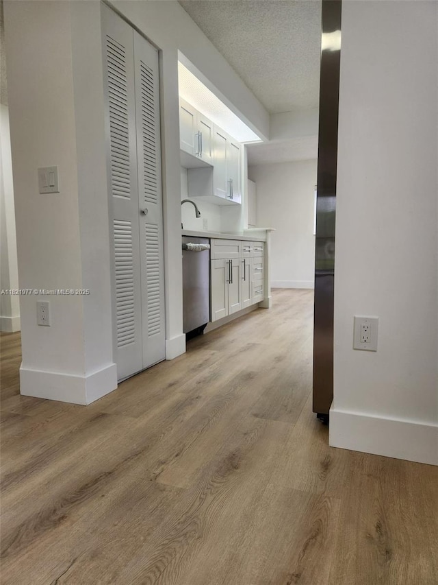 12755 SW 16th Ct Unit 201B, Pembroke Pines, FL 33027 - hall featuring baseboards and light wood-style flooring
