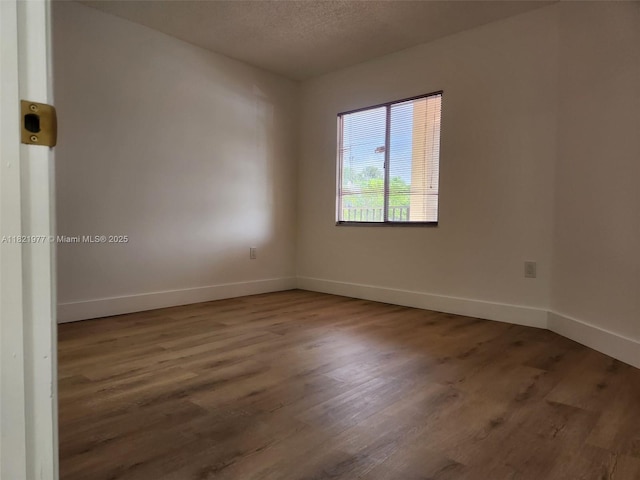 12755 SW 16th Ct Unit 201B, Pembroke Pines, FL 33027 - unfurnished room featuring wood finished floors and a textured ceiling