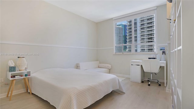 801 Brickell Key Blvd Unit 2210, Miami, FL 33131 - bedroom featuring wood finished floors and an office area