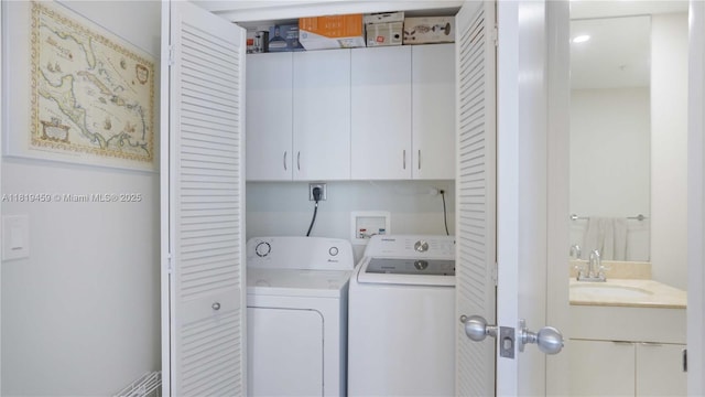 801 Brickell Key Blvd Unit 2210, Miami, FL 33131 - laundry room featuring cabinet space and washer and clothes dryer