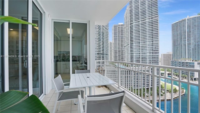 801 Brickell Key Blvd Unit 2210, Miami, FL 33131 - balcony with view of pool, a city view, and outdoor dining space