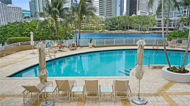 801 Brickell Key Blvd Unit 2210, Miami, FL 33131 - community pool featuring a patio area, a view of city, and a water view