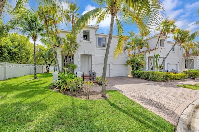 21235 NE 33rd Ave, Aventura, FL 33180 - mediterranean / spanish-style home featuring decorative driveway, stucco siding, and a garage