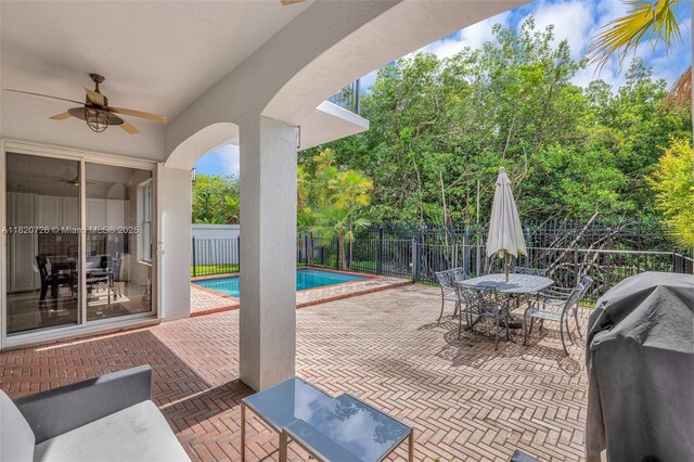 21235 NE 33rd Ave, Aventura, FL 33180 - view of patio with a grill, ceiling fan, outdoor dining area, and view of wooded area