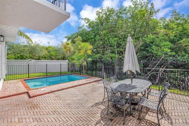 21235 NE 33rd Ave, Aventura, FL 33180 - view of swimming pool featuring a patio area and outdoor dining area