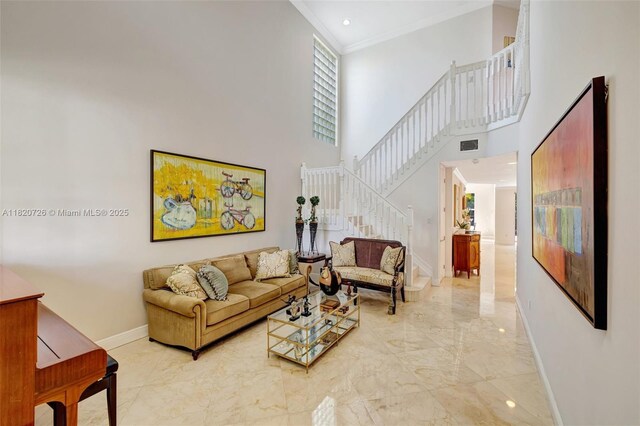 21235 NE 33rd Ave, Aventura, FL 33180 - living room with light marble finish floors, stairway, a high ceiling, and ornamental molding