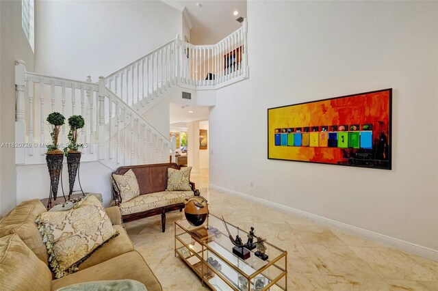 21235 NE 33rd Ave, Aventura, FL 33180 - living area featuring stairs, a high ceiling, and marble finish flooring