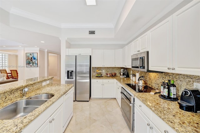 21235 NE 33rd Ave, Aventura, FL 33180 - kitchen featuring stainless steel appliances, backsplash, ornamental molding, white cabinets, and light stone countertops