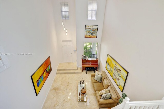 21235 NE 33rd Ave, Aventura, FL 33180 - living area with a towering ceiling and marble look tile flooring