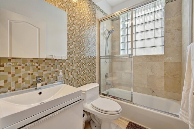 21235 NE 33rd Ave, Aventura, FL 33180 - full bath featuring tile walls, combined bath / shower with glass door, vanity, and tasteful backsplash