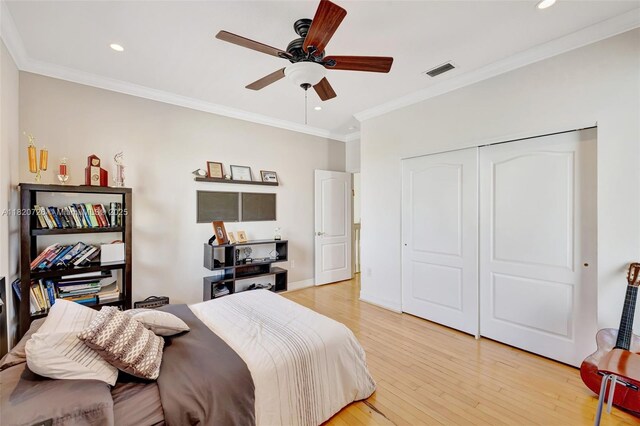 21235 NE 33rd Ave, Aventura, FL 33180 - bedroom with light wood-type flooring, ornamental molding, a closet, recessed lighting, and a ceiling fan